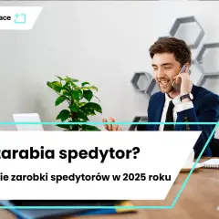 Młody mężczyzna w garniturze rozmawia przez telefon w nowoczesnym biurze.